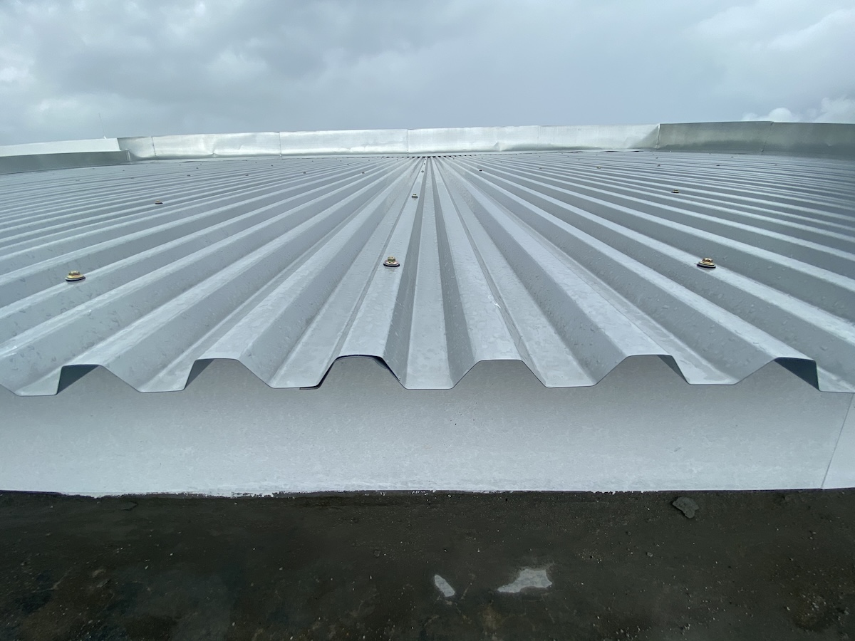 A close-up view of a grey corrugated metal roof